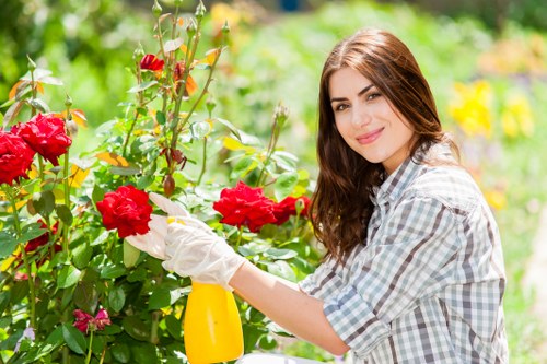 Gardener using protective equipment during outdoor maintenance